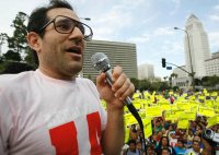 United states Apparel owner Dov Charney talks during a May Day rally protest march for immigrant legal rights.