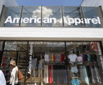 Passers-by walk past an American Apparel shop when you look at the Shadyside community of Pittsburgh.