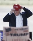 Reactionary: Among the items in the collection tend to be a cap, T-shirt and tank top utilizing the slogan motivated by Donald Trump, pictured wearing a 'Make America Great Again' limit, and a tote case and Pride banner T-shirt