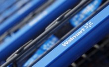 Shopping carts are seen outside an innovative new Wal-Mart Express store in Chicago July 26, 2011. REUTERS/John Gress/Files - RTSEZP9