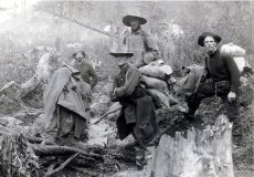 vintage men in woods with hats rucksacks outdoor gear